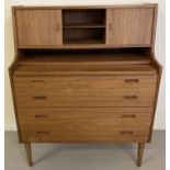 A mid century teak 4 drawer bureau/vanity chest with pull out/lift up mirrored section.