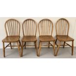 A set of 4 Ercol Windsor stick back chairs with early CC41 Utility stamp.