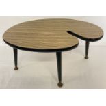 A small vintage 1960's Formica topped coffee table with screw in tapered legs.