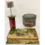 A vintage Huntley & Palmers biscuit tin depicting a horse and carriage scene.