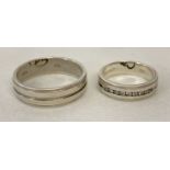 A matching set of ladies and mens silver wedding rings.