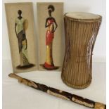 A collection of vintage ethinic pieces. A wooden and leather double ended tribal drum.