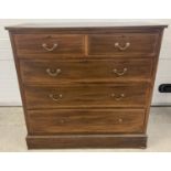 An Edwardian 2 over 3 chest of drawers in inlayed mahogany with brass drop down handles.