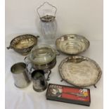 A small collection of vintage silver plated table ware to inlcude biscuit jar and tankards.