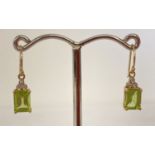 A pair of 9ct gold peridot and diamond drop style earrings.