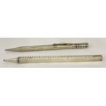 2 1920's silver propelling pencils. A novelty extending ruler pencil (extends to 12"), B'ham 1923.