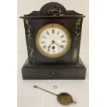 A Victorian slate and marble mantle clock with enamelled face.