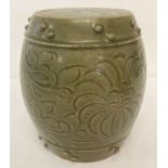 A small Chinese ceramic, celadon glazed barrel seat with studded detail and floral decoration.