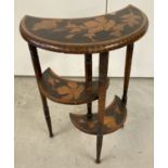 An Edwardian poker work crescent shaped occasional table with turned legs and floral detail.