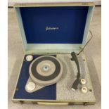 A small vintage portable 4 speed record player by Portadyne.