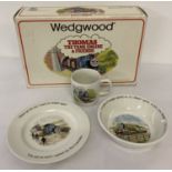 A boxed Thomas The Tank Engine & Friends child's ceramic plate, bowl and mug gift set by Wedgwood.
