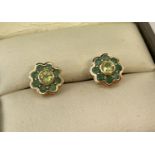 A pair of 9ct gold emerald and peridot flower design stud earrings.