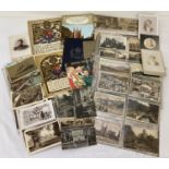 A box of assorted vintage ephemera to include postcards and cabinet cards.
