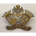 An antique white metal Ypres sweetheart brooch with gold coloured overlay detail.