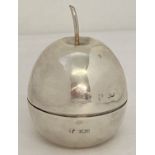 An Edwardian silver novelty apple shaped string box, base & lid fully hallmarked.