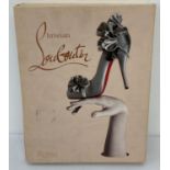 Christian Louboutin - hardback monograph with fold out cover, from Rizzoli, New York, 2011.