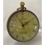 A brass bound, desk top glass ball watch with Roman Numeral markers.