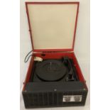 A black painted portable record player by Ultra. Shows sign of original red colour to interior.