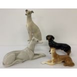 4 ceramic dog figurines, 3 greyhounds and a Dachshund.