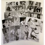 A collection of 31 black and white photographs of vintage, mostly 1980's, glamour and erotic models.