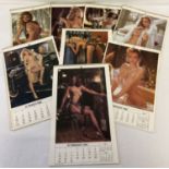 A collection of 8 x 1980's spiral bound wall hanging Playboy calendars.