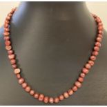 A 15" dyed freshwater pearl necklace with silver tone magnetic barrel clasp.