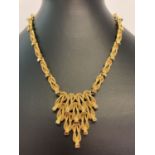 A vintage 1970's gold tone necklace with fixed hanging pendant, Marked to reverse '1594'.