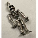 A 925 silver pendant in the form of an articulated skeleton.