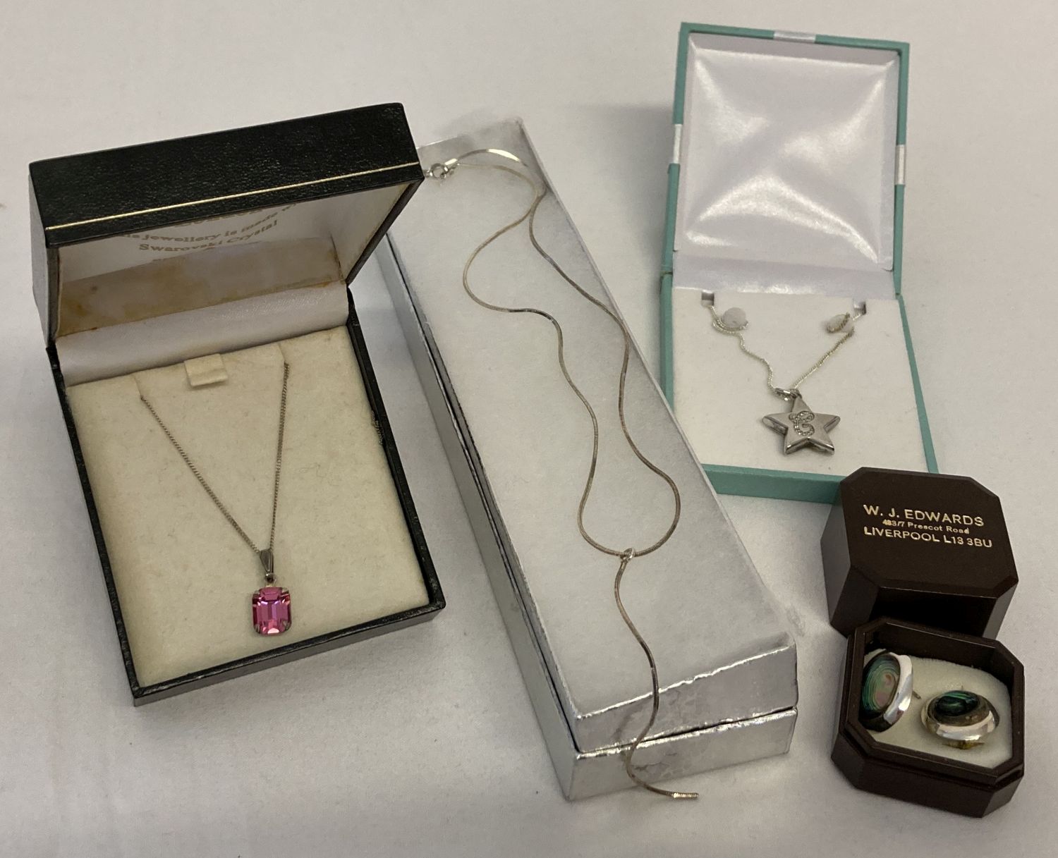 4 items of boxed silver jewellery.