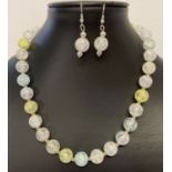 A 17" multicoloured rock crystal beaded necklace with matching drop earrings.