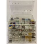 A jewellery makers Perspex chest of drawers and hanging hooks back panel.