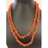 A vintage 40 inch branch coral necklace with push barrel clasp.