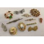12 vintage and modern brooches and scarf clips. To include stone set.