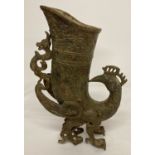 A Chinese bronze archaic style vase in the shape of a mythical creature.