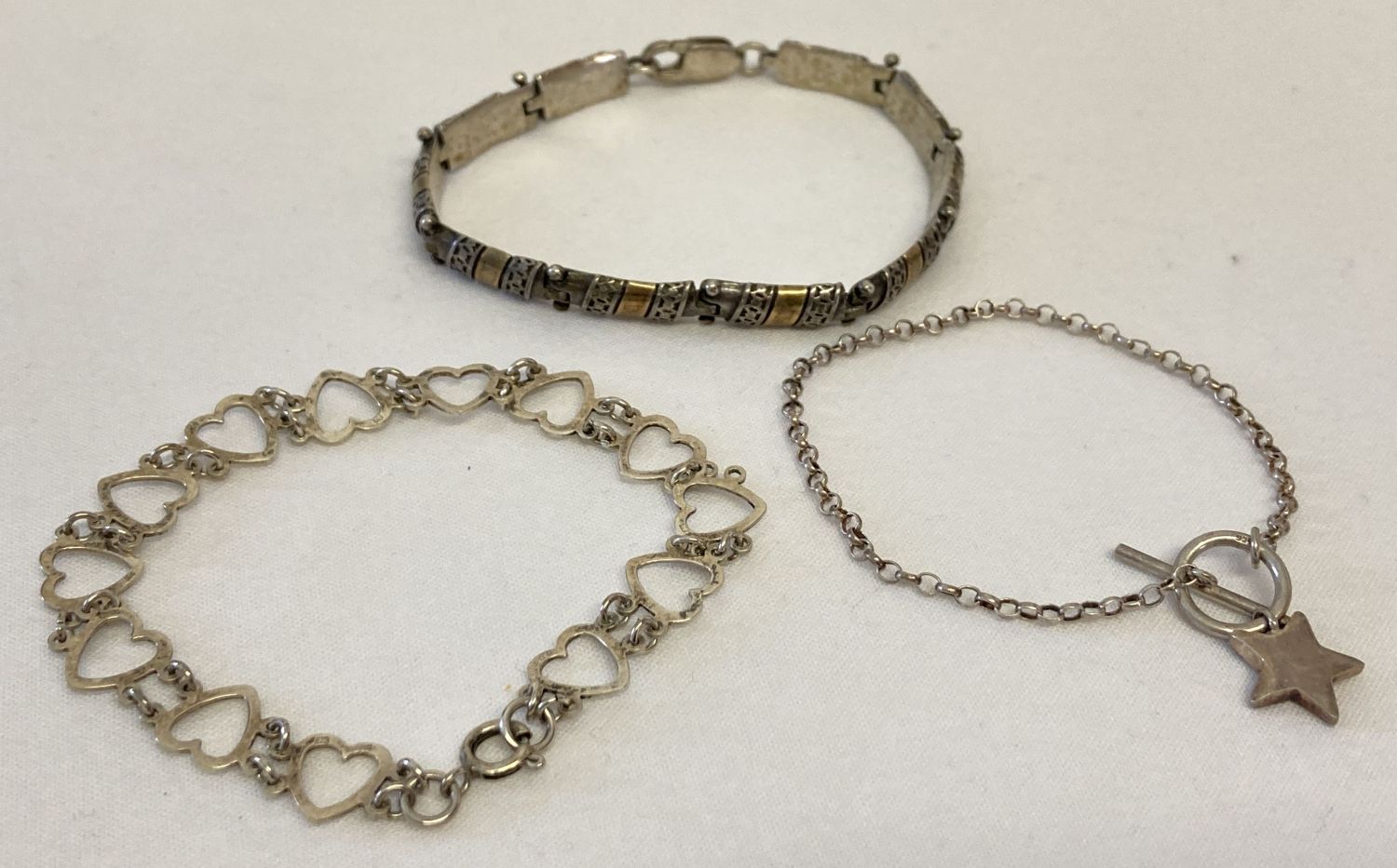 3 modern and vintage silver bracelets.