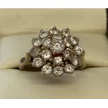 A 9ct gold and clear stone large cluster style dress ring.