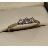 A vintage 9ct gold and platinum trilogy diamond ring.