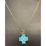 An 18ct gold 20 inch fine box chain with small turquoise cross pendant with gold accent detail.