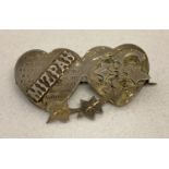 An antique silver Mizpah sweetheart brooch with ivy leaf detail.