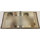 A photograph album containing a quantity of assorted vintage colour nude and erotic photographs.