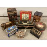 A collection of assorted vintage biscuit tins and cash tins.