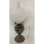 A vintage Duplex twin wick oil lamp, complete with chimney, white glass globe shade & spare chimney.