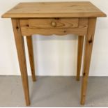A modern pine hall/side table with central drawer, raised on tall tapered legs