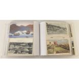 An album containing 200 vintage and modern British postcards.