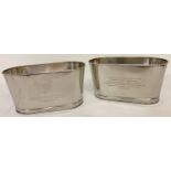 A small pair of Bollinger Champagne buckets with engraved details to sides.