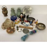 A box of assorted misc. oriental items to include ceramics and fabric pieces.