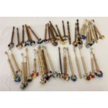2 bags of assorted wooden and plastic handled beaded lacemaking bobbins.