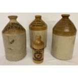 4 vintage local interest advertising stone ware bottles.