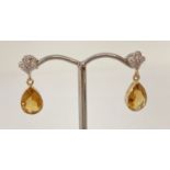 A pair of 9ct gold citrine and diamond set drip earrings.