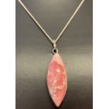 A modern marquise shaped rhodochrosite set pendant on a 24 inch fine silver curb chain.